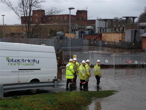 Engineers at a flooded substation